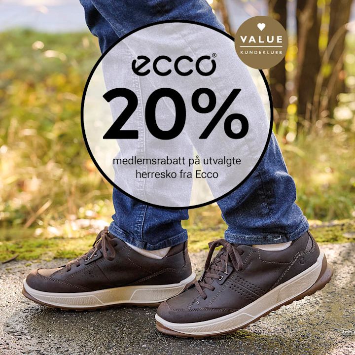 Mørkebrune Ecco sneakers i skinn med hvit såle og snøring, brukt med blå jeans utendørs.